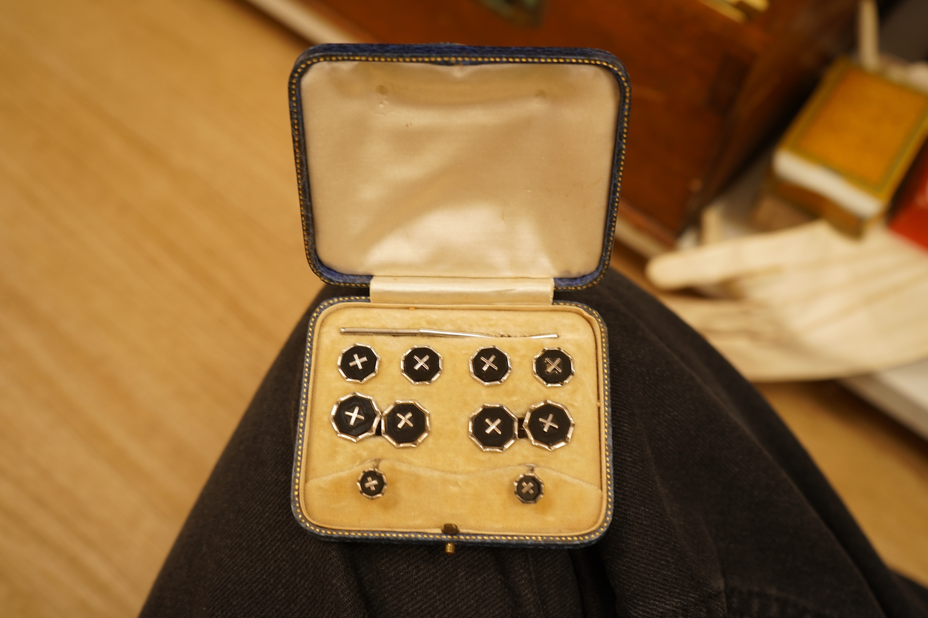 An early 20th century Mappin & Webb canteen and assorted plate other cutlery a boxed set of black enamelled studs and cufflinks etc